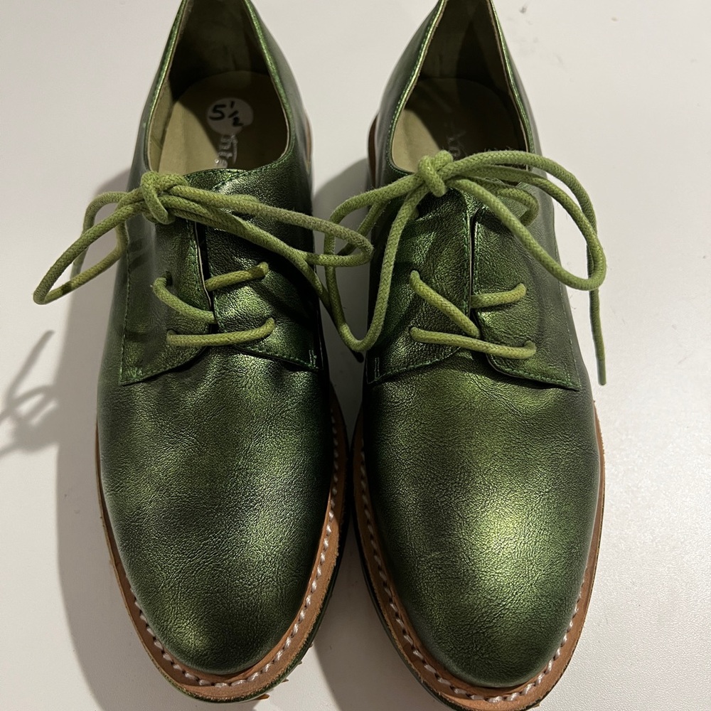 Antelope metallic green leather lace up platform shoes